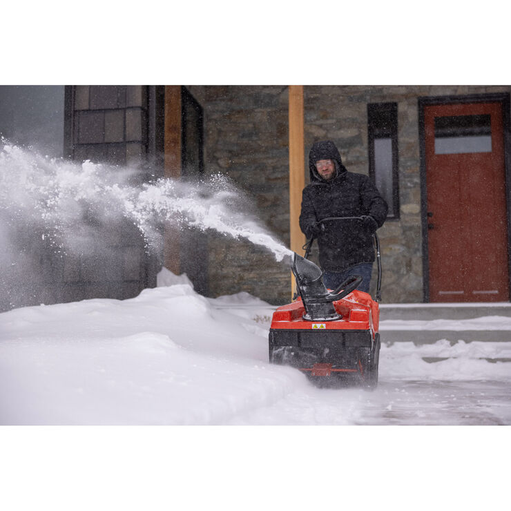 Troy-Bilt&reg; Arctic Squall&trade; 179E Snow Blower Clearing Driveway